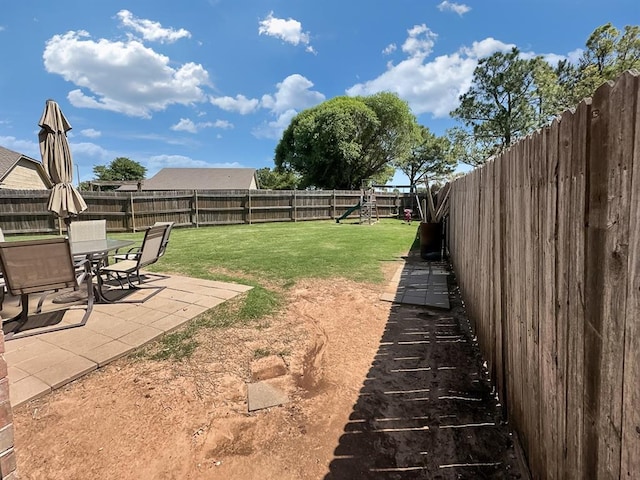 3105 SW 104th Ter, Oklahoma City, OK 73159 - view of yard with a patio area and a playground