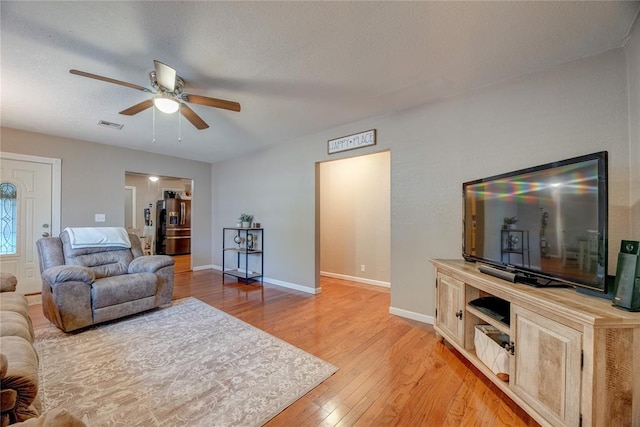 408 S 6th St, Davis, OK 73030 - living area featuring ceiling fan, light wood-style floors, and baseboards