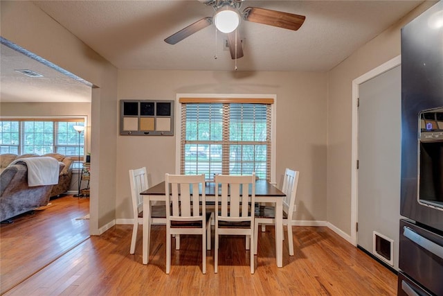 408 S 6th St, Davis, OK 73030 - dining room featuring light wood finished floors, a ceiling fan, and baseboards