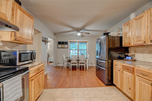 408 S 6th St, Davis, OK 73030 - kitchen with stainless steel appliances, light brown cabinetry, a ceiling fan, decorative backsplash, and under cabinet range hood