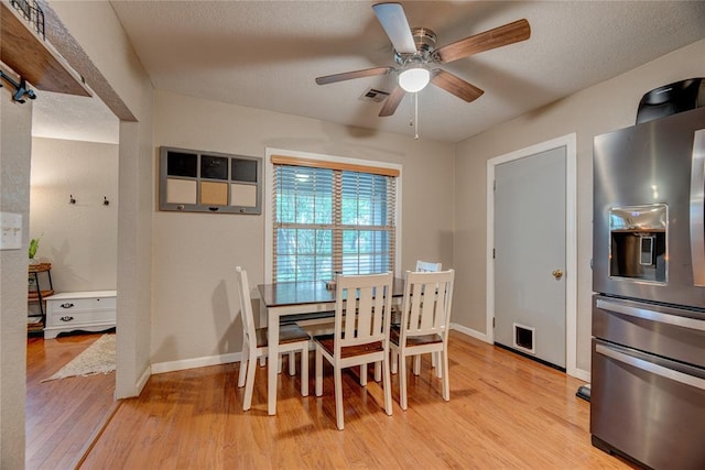 408 S 6th St, Davis, OK 73030 - dining room with light wood-style floors, a ceiling fan, and baseboards