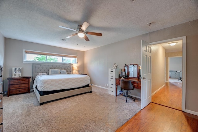408 S 6th St, Davis, OK 73030 - bedroom with a desk, wood-type flooring, a textured ceiling, ceiling fan, and baseboards