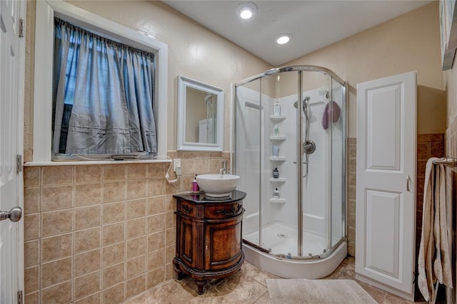 408 S 6th St, Davis, OK 73030 - full bath featuring a stall shower, tile walls, vanity, and a wainscoted wall
