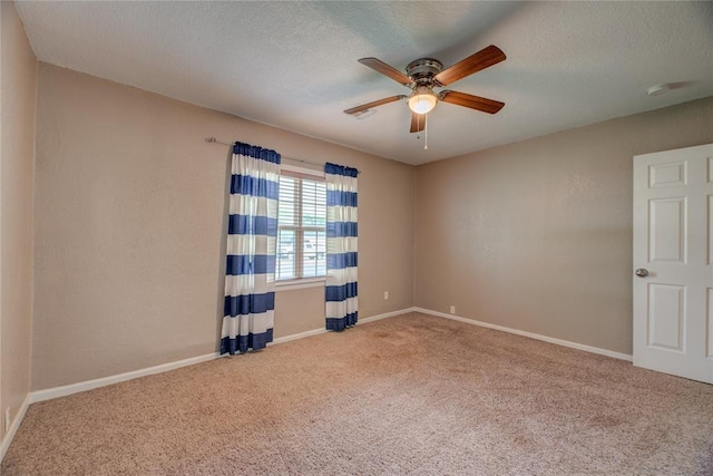 408 S 6th St, Davis, OK 73030 - carpeted empty room with a ceiling fan, baseboards, and a textured ceiling