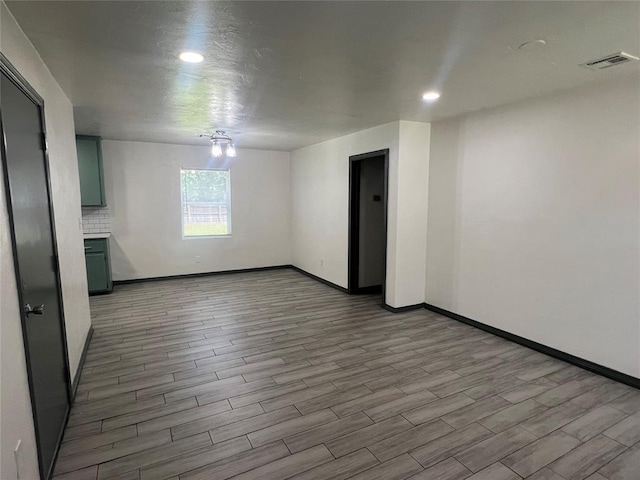 6505 NW 34th St, Bethany, OK 73008 - empty room with baseboards, wood finished floors, and recessed lighting