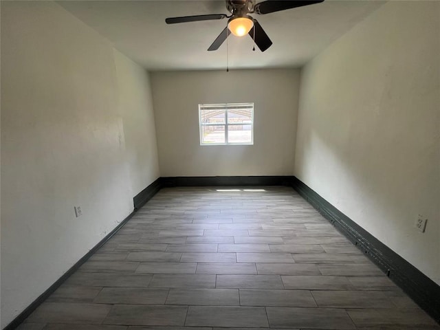 6505 NW 34th St, Bethany, OK 73008 - unfurnished room with a ceiling fan, baseboards, and wood finished floors
