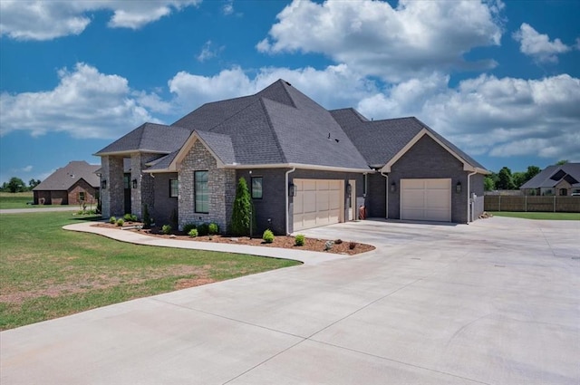 1008 Collis Way, Newcastle, OK 73065 - view of front of property with an attached garage, driveway, brick siding, and a shingled roof