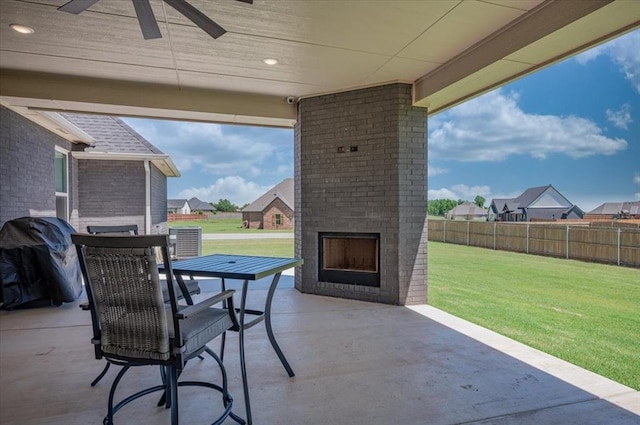 1008 Collis Way, Newcastle, OK 73065 - view of patio / terrace featuring an outdoor brick fireplace, ceiling fan, a residential view, and outdoor dining area
