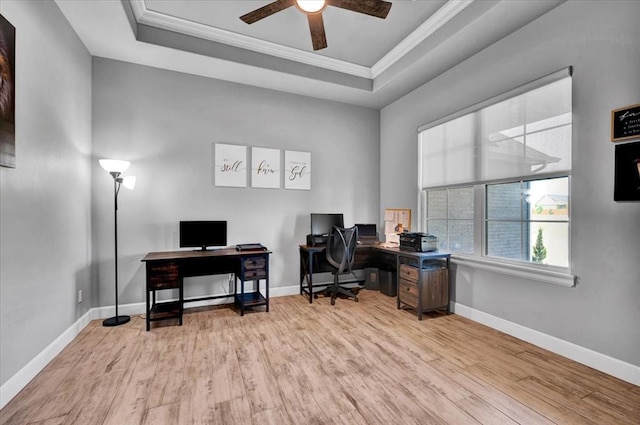 1008 Collis Way, Newcastle, OK 73065 - home office featuring light wood-style floors, a tray ceiling, ceiling fan, ornamental molding, and baseboards