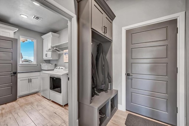 1008 Collis Way, Newcastle, OK 73065 - mudroom featuring washing machine and clothes dryer and light wood finished floors