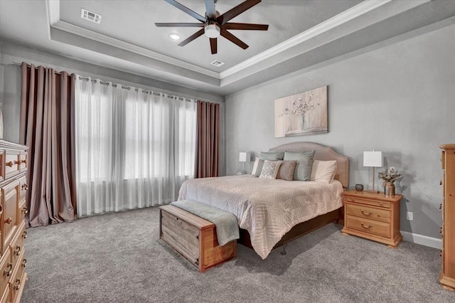 1008 Collis Way, Newcastle, OK 73065 - bedroom featuring a tray ceiling, ornamental molding, carpet floors, baseboards, and a ceiling fan