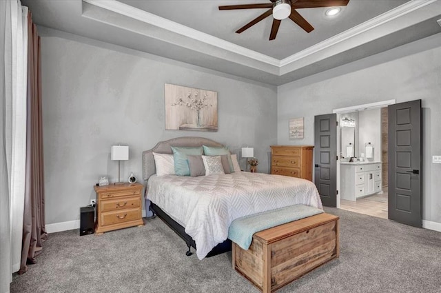 1008 Collis Way, Newcastle, OK 73065 - bedroom featuring a tray ceiling, carpet floors, crown molding, baseboards, and ensuite bath