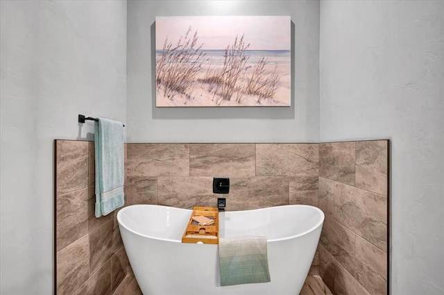 1008 Collis Way, Newcastle, OK 73065 - bathroom with a soaking tub and tile walls