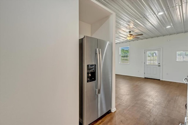 2273 County Road 1240, Blanchard, OK 73010 - kitchen with stainless steel fridge with ice dispenser, a ceiling fan, baseboards, and wood finished floors