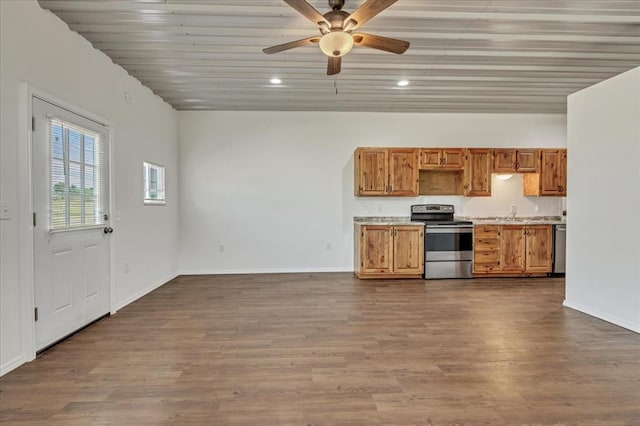 2273 County Road 1240, Blanchard, OK 73010 - kitchen with stainless steel appliances, ceiling fan, brown cabinetry, recessed lighting, and light countertops