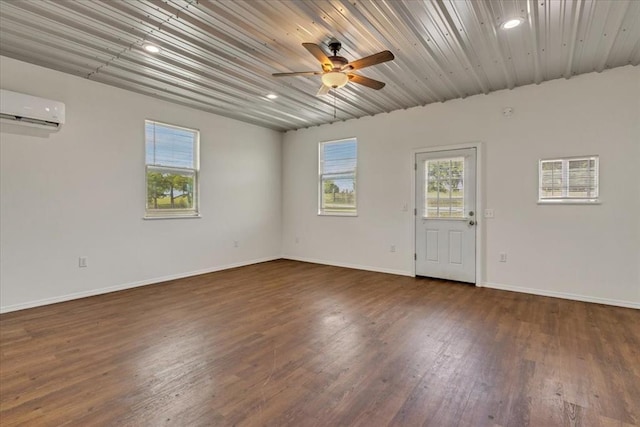 2273 County Road 1240, Blanchard, OK 73010 - spare room with a wall unit AC, ceiling fan, baseboards, recessed lighting, and wood finished floors