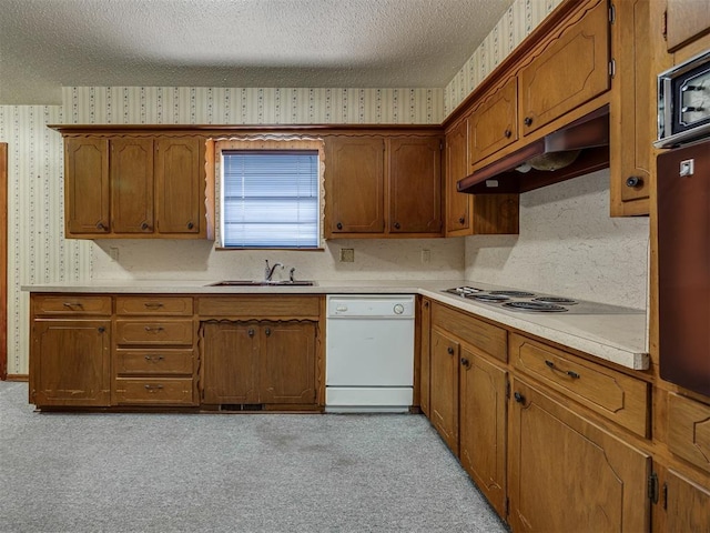 4004 N Shannon Ave, Bethany, OK 73008 - kitchen with white dishwasher, wallpapered walls, under cabinet range hood, electric stovetop, and a textured ceiling