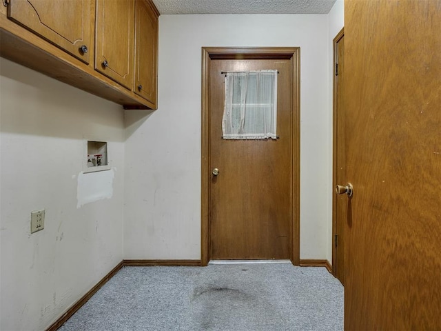 4004 N Shannon Ave, Bethany, OK 73008 - laundry area with cabinet space, washer hookup, carpet flooring, baseboards, and a textured ceiling