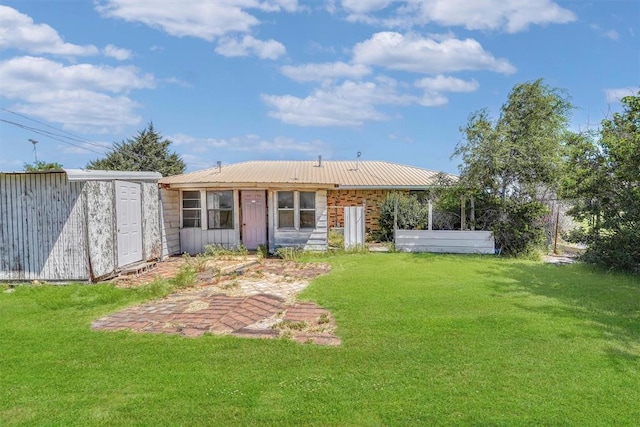 508 E Parker St, Granite, OK 73547 - rear view of property featuring a yard and metal roof