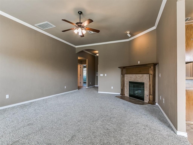 7909 Dawn Cir, Oklahoma City, OK 73135 - unfurnished living room featuring arched walkways, ceiling fan, carpet flooring, baseboards, and ornamental molding