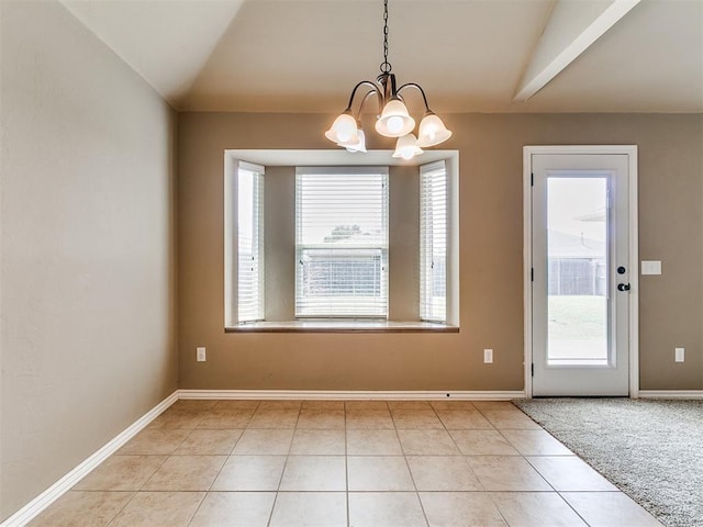 7909 Dawn Cir, Oklahoma City, OK 73135 - unfurnished dining area featuring a chandelier, baseboards, and light tile patterned floors