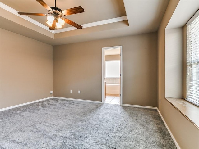 7909 Dawn Cir, Oklahoma City, OK 73135 - carpeted empty room with a raised ceiling, baseboards, a ceiling fan, and ornamental molding