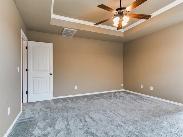 7909 Dawn Cir, Oklahoma City, OK 73135 - unfurnished room featuring a raised ceiling, carpet, a ceiling fan, and ornamental molding
