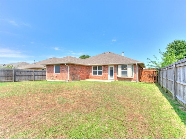 7909 Dawn Cir, Oklahoma City, OK 73135 - back of house with brick siding and a gate