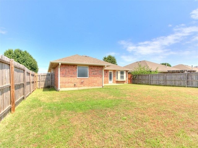 7909 Dawn Cir, Oklahoma City, OK 73135 - back of house featuring brick siding