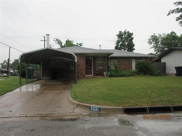 2231 SW 52nd Sts, Oklahoma City, OK 73119 - view of front of property with a front yard, driveway, and brick siding