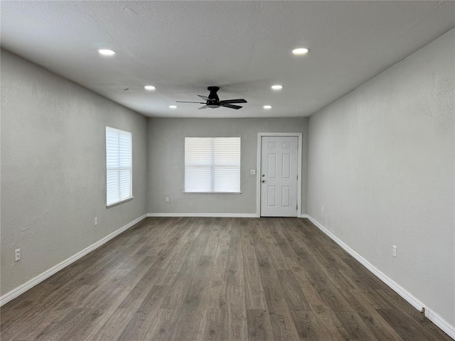 214 N 3rd St, Sentinel, OK 73664 - empty room with a ceiling fan, dark wood-type flooring, recessed lighting, and baseboards
