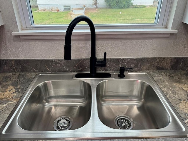 214 N 3rd St, Sentinel, OK 73664 - kitchen view of a sink, a textured wall, and dark countertops