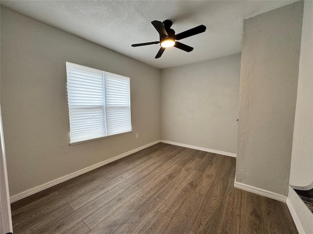 214 N 3rd St, Sentinel, OK 73664 - spare room with wood finished floors, ceiling fan, baseboards, and a textured ceiling