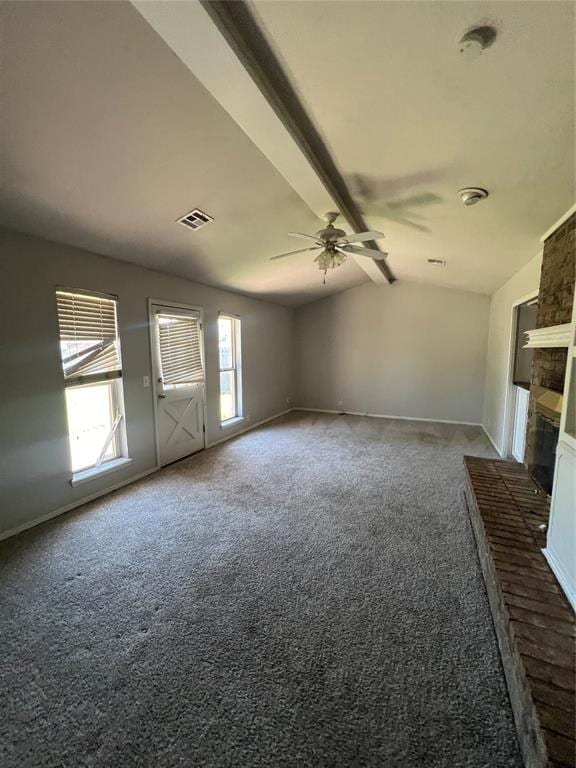 908 Linn Ln, Yukon, OK 73099 - unfurnished living room featuring a ceiling fan, carpet floors, a brick fireplace, and baseboards