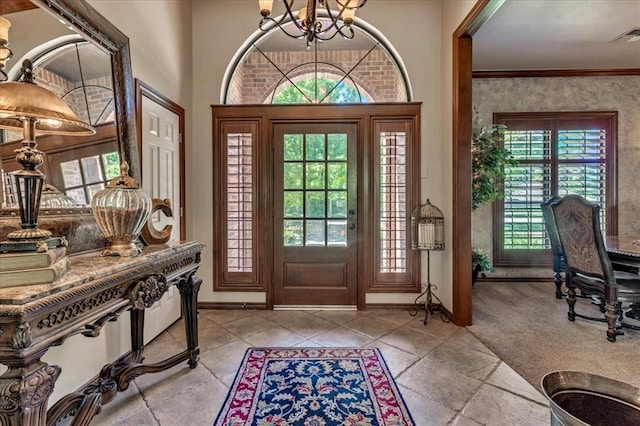 1322 Mockingbird Ln, Guthrie, OK 73044 - foyer featuring a chandelier and baseboards