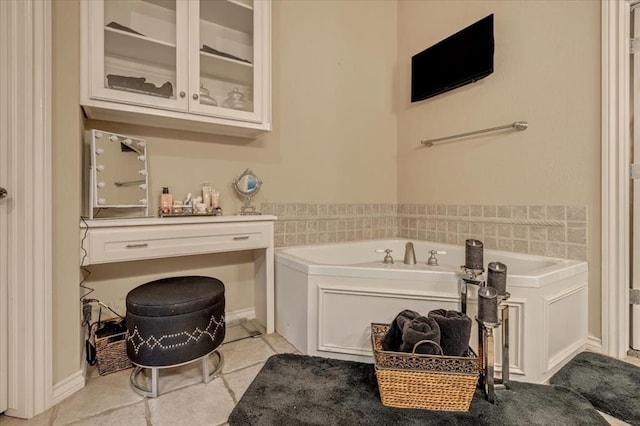 1322 Mockingbird Ln, Guthrie, OK 73044 - bathroom featuring a garden tub and tile patterned flooring