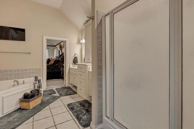 1322 Mockingbird Ln, Guthrie, OK 73044 - bathroom featuring tile patterned flooring, lofted ceiling, a stall shower, a bath, and vanity