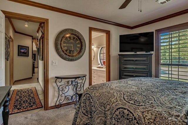 1322 Mockingbird Ln, Guthrie, OK 73044 - bedroom featuring ornamental molding, baseboards, ensuite bathroom, light carpet, and ceiling fan