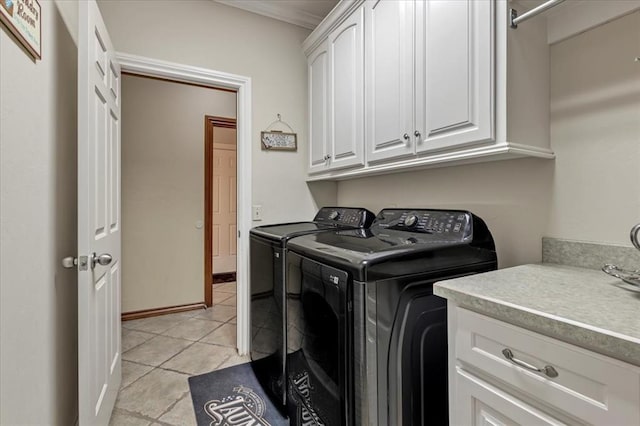 1322 Mockingbird Ln, Guthrie, OK 73044 - washroom with cabinet space, washing machine and clothes dryer, and light tile patterned flooring