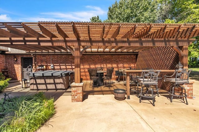 1322 Mockingbird Ln, Guthrie, OK 73044 - view of patio / terrace with outdoor dining area, a pergola, and a hot tub