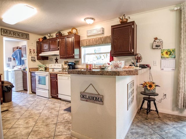 920245 S 3300th Rd, Wellston, OK 74881 - kitchen featuring white appliances, under cabinet range hood, washer / clothes dryer, tile counters, and light tile patterned floors