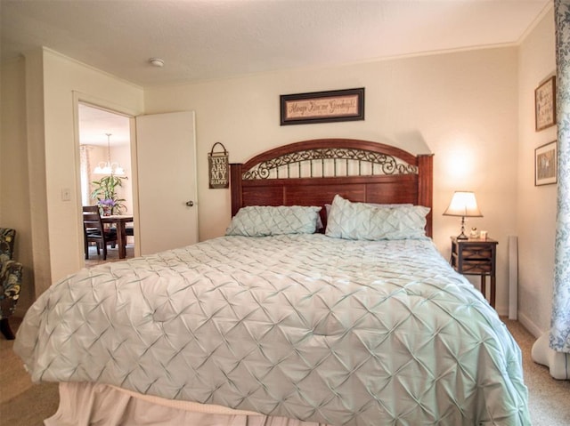 920245 S 3300th Rd, Wellston, OK 74881 - carpeted bedroom with a chandelier and crown molding