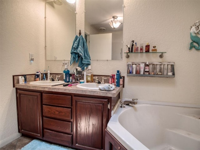 920245 S 3300th Rd, Wellston, OK 74881 - full bath featuring a bath, double vanity, a textured wall, and tile patterned floors