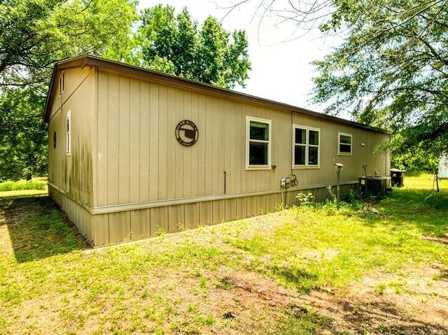 920245 S 3300th Rd, Wellston, OK 74881 - view of side of home featuring central AC unit and a lawn