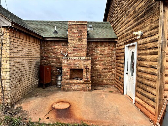 2862 S Indian Meridian Rd, Meridian, OK 73058 - view of patio / terrace with an outdoor brick fireplace
