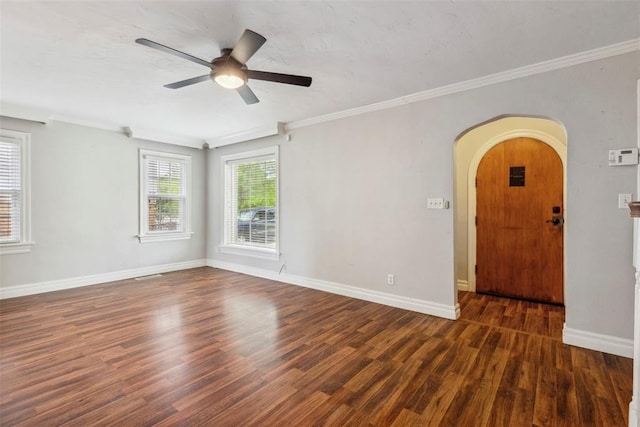 1535 NW 39th St, Oklahoma City, OK 73118 - unfurnished room with ceiling fan, wood finished floors, baseboards, ornamental molding, and arched walkways