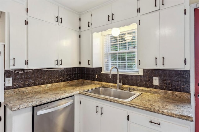 1535 NW 39th St, Oklahoma City, OK 73118 - kitchen featuring dishwasher, a sink, tasteful backsplash, and white cabinetry