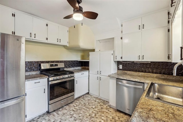 1535 NW 39th St, Oklahoma City, OK 73118 - kitchen with stainless steel appliances, a ceiling fan, a sink, backsplash, and white cabinetry