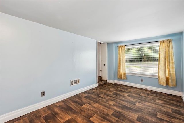 1535 NW 39th St, Oklahoma City, OK 73118 - spare room featuring baseboards and dark wood finished floors