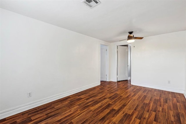 1535 NW 39th St, Oklahoma City, OK 73118 - spare room featuring dark wood-style floors, baseboards, and ceiling fan